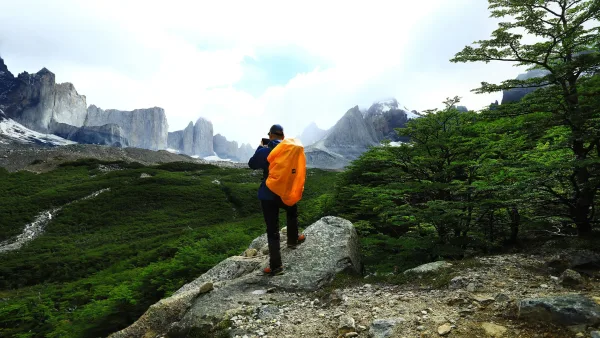 A high-altitude view from the heart of the French Valley at Mirador Británico, surrounded by massive granite walls.