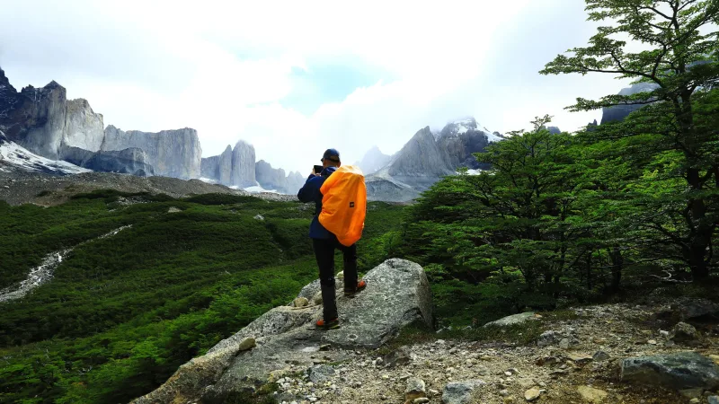 A high-altitude view from the heart of the French Valley at Mirador Británico, surrounded by massive granite walls.