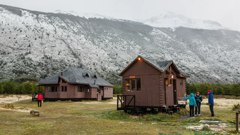 Backpackers arriving at Refugio Dickson after a long trek through the Patagonian wilderness.