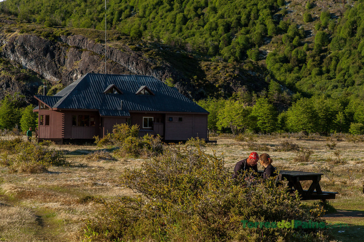 Close-up of the rustic architecture and balcony at Refugio Dickson overlooking the Dickson Lake.