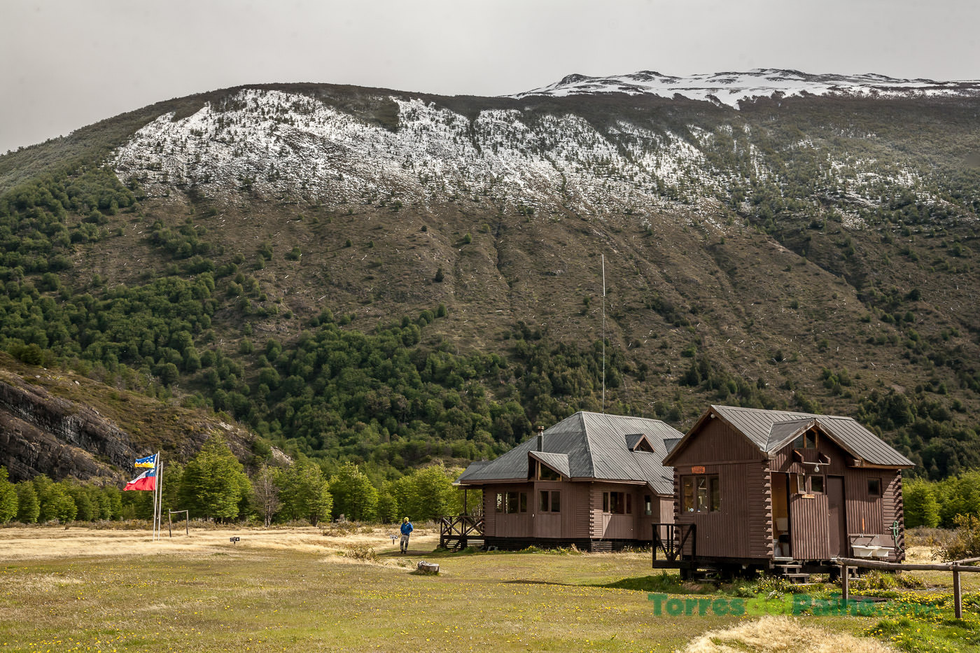 Early morning sunlight illuminating the peaks surrounding the Dickson valley and the mountain lodge.