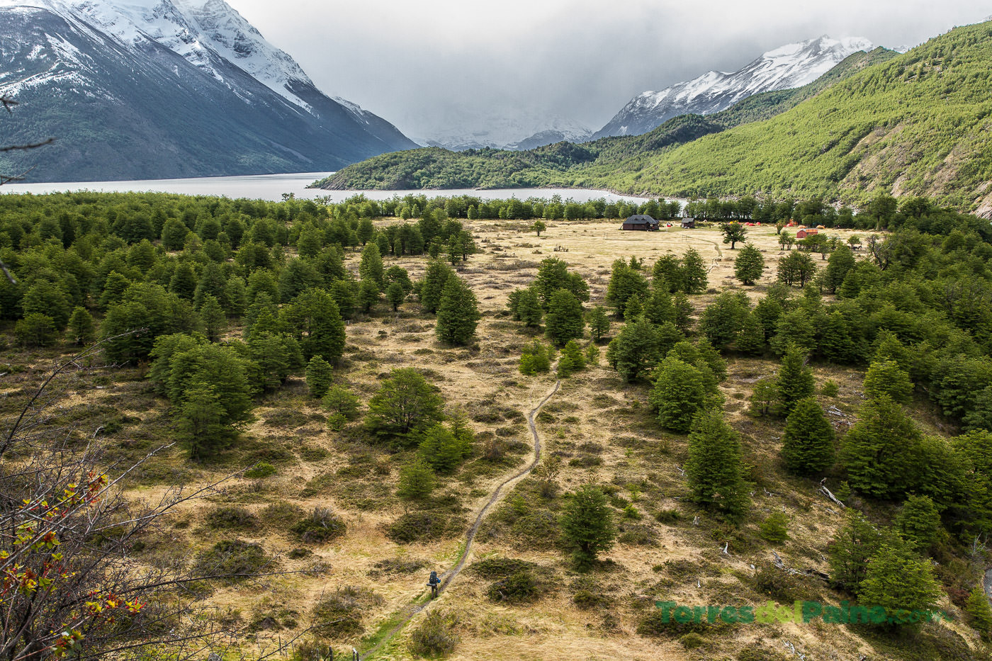 Hikers relaxing outside the lodge at Dickson, enjoying the panoramic views of the northern circuit.