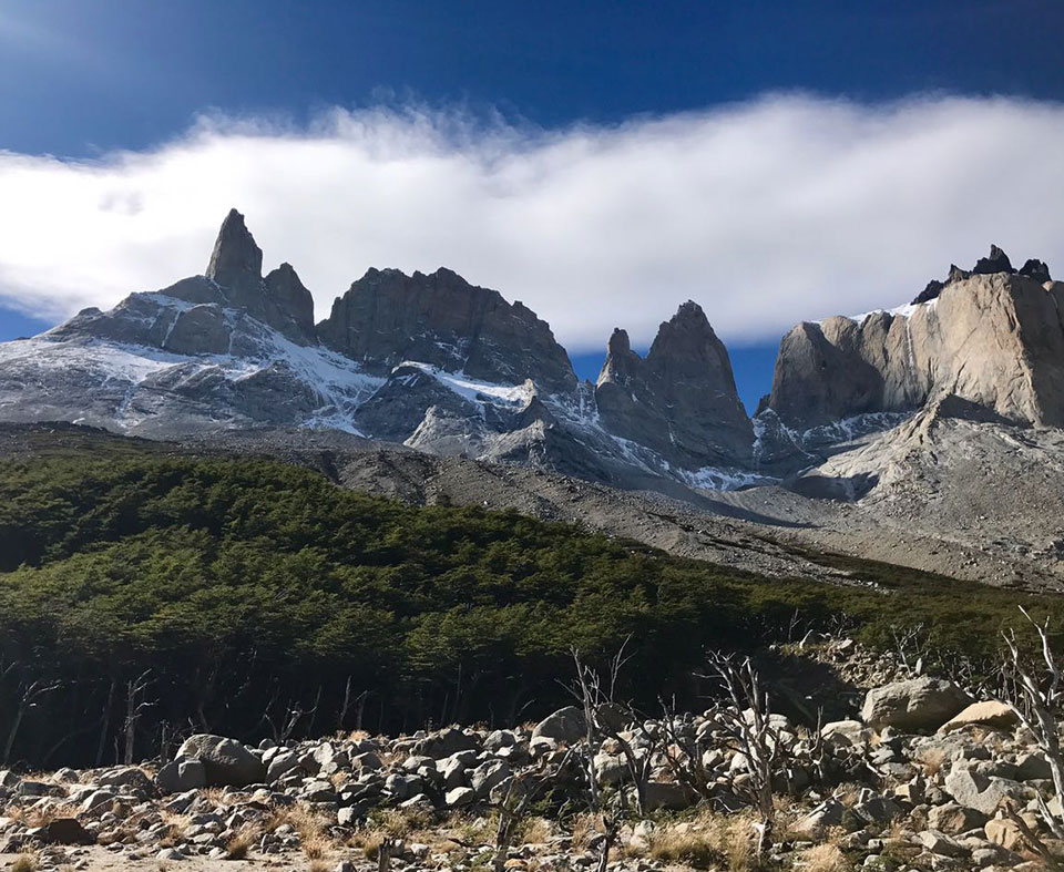 Jagged rock formations and snow-capped summits overlooking the trek through the French Valley.