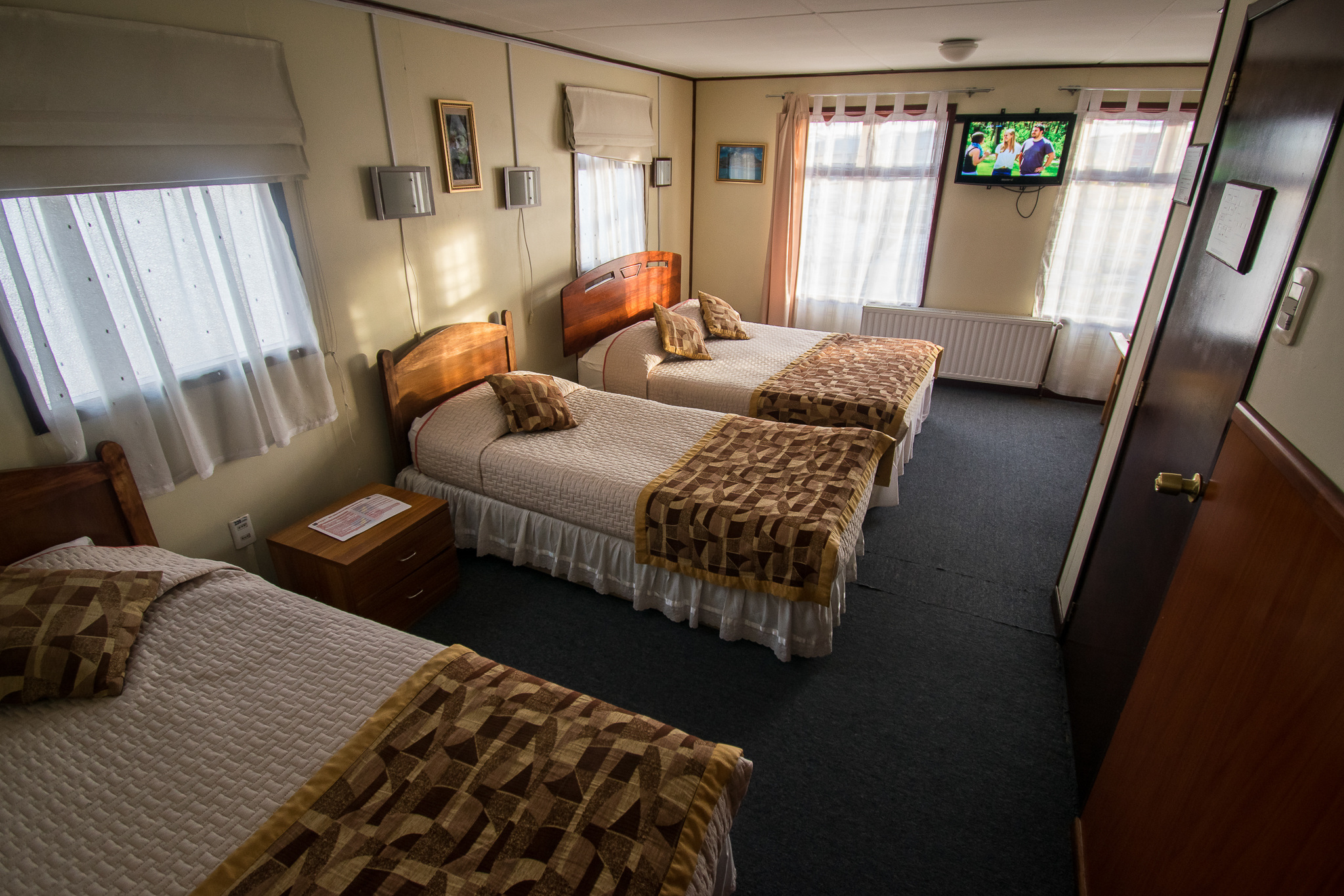 Side view of the Hotel Alcazar building showing its modern architectural style.