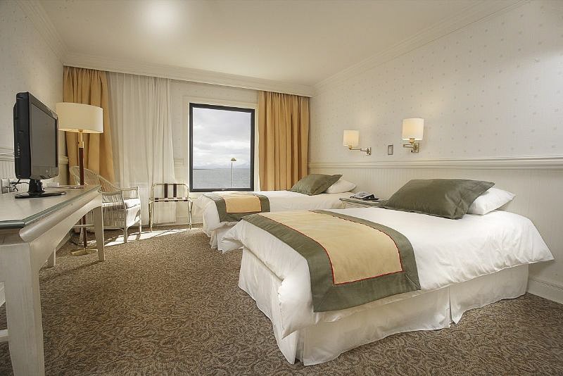 The spacious dining area at Hotel Costa Australis where breakfast is served with a view of the fjords.