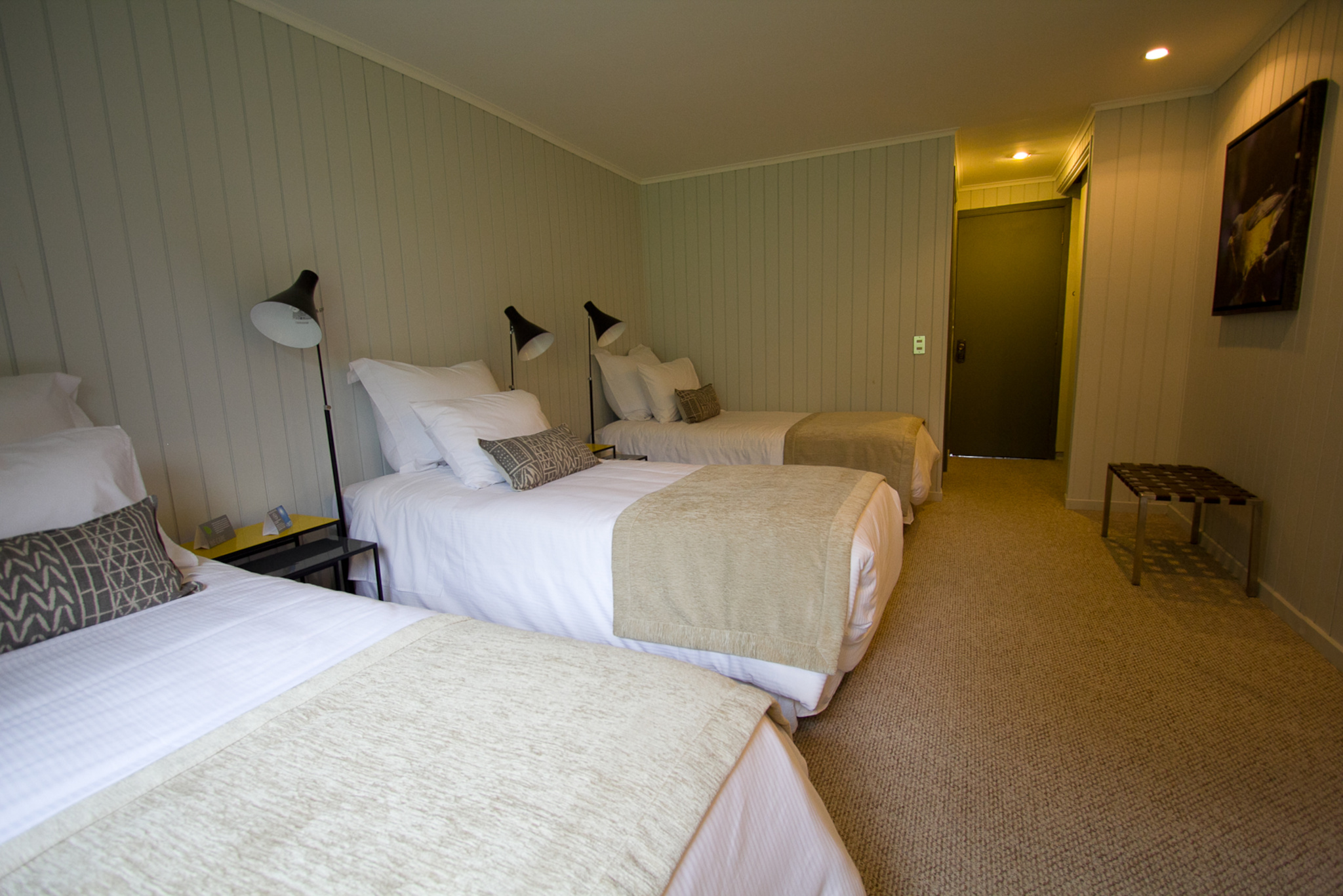 Guests enjoying a cocktail at the Bar Grey with a stunning view of the icebergs floating in the lake.