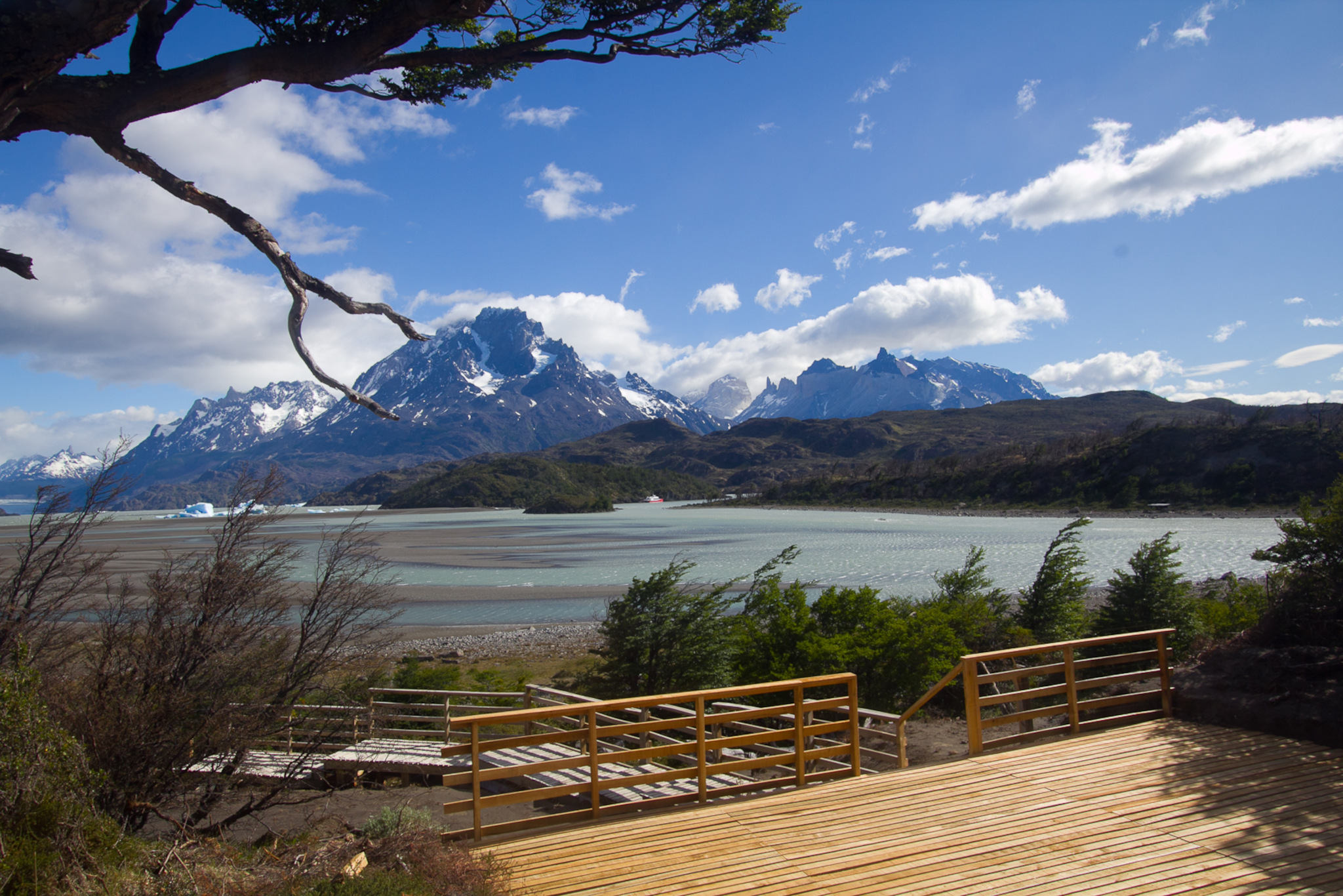 A standard double room at Hotel Lago Grey featuring warm wood finishes and Patagonian decor.