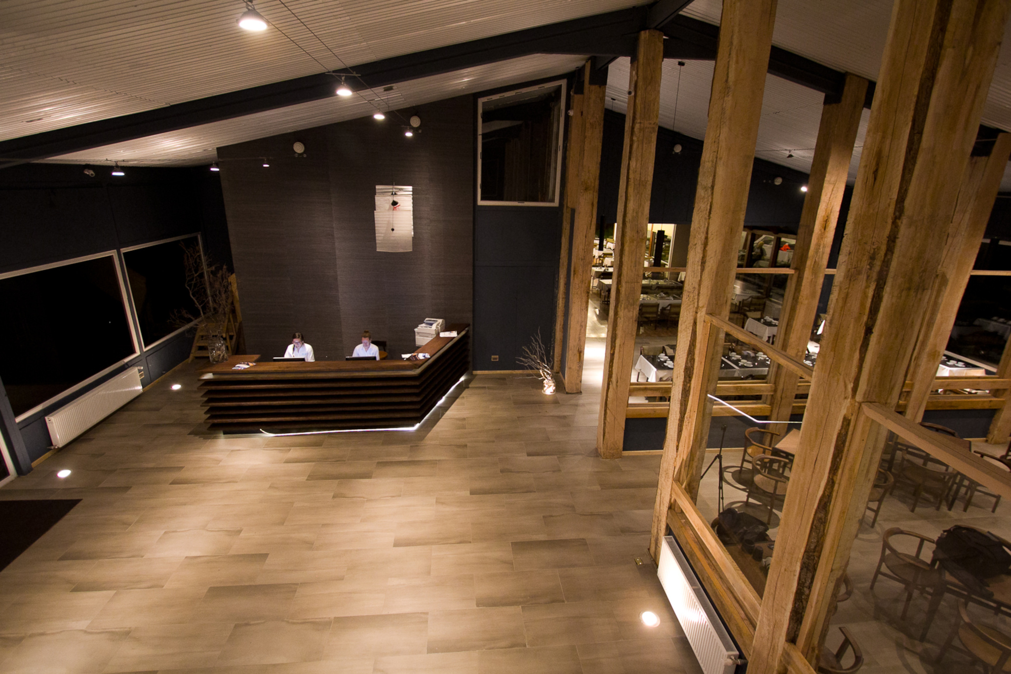 Detail of the exterior architecture of Hotel Lago Grey blending into the natural landscape.