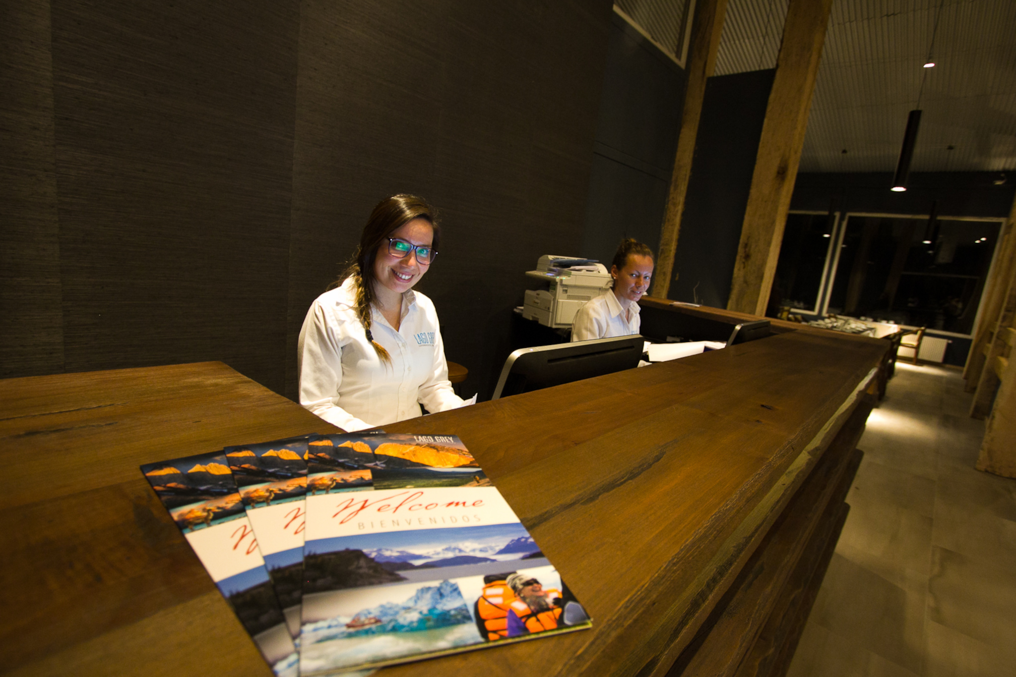 View from the hotel terrace of a large iceberg drifting near the shore of Lake Grey.