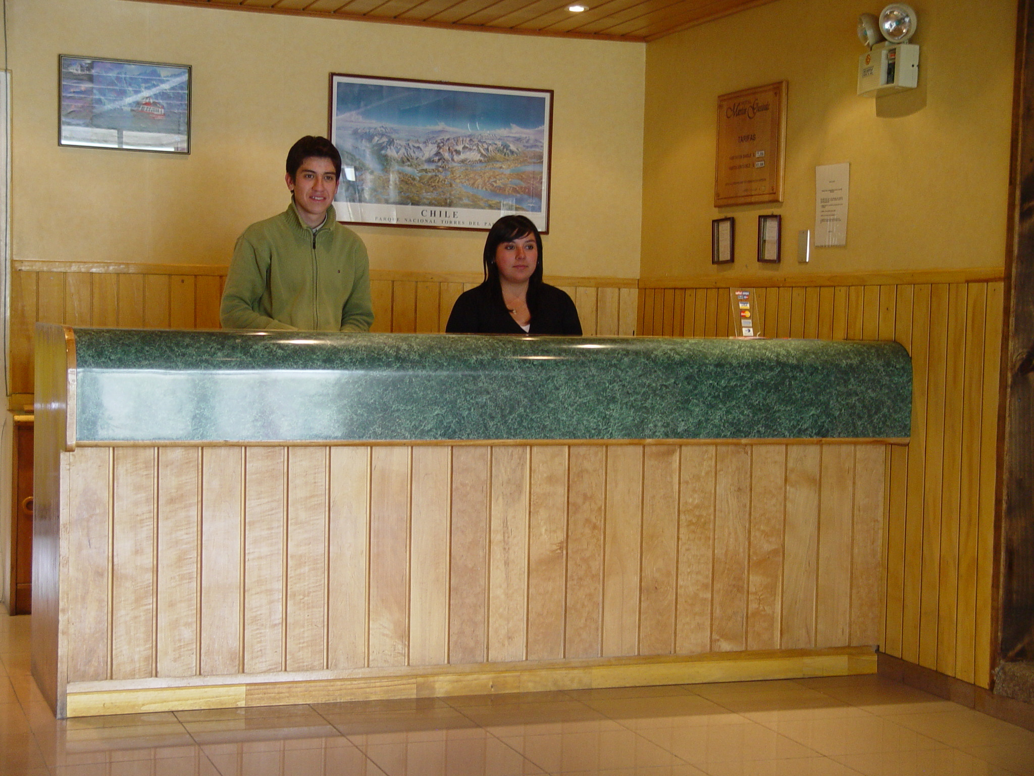 Spacious family room at Hotel Martin Gusinde designed for comfort and convenience.