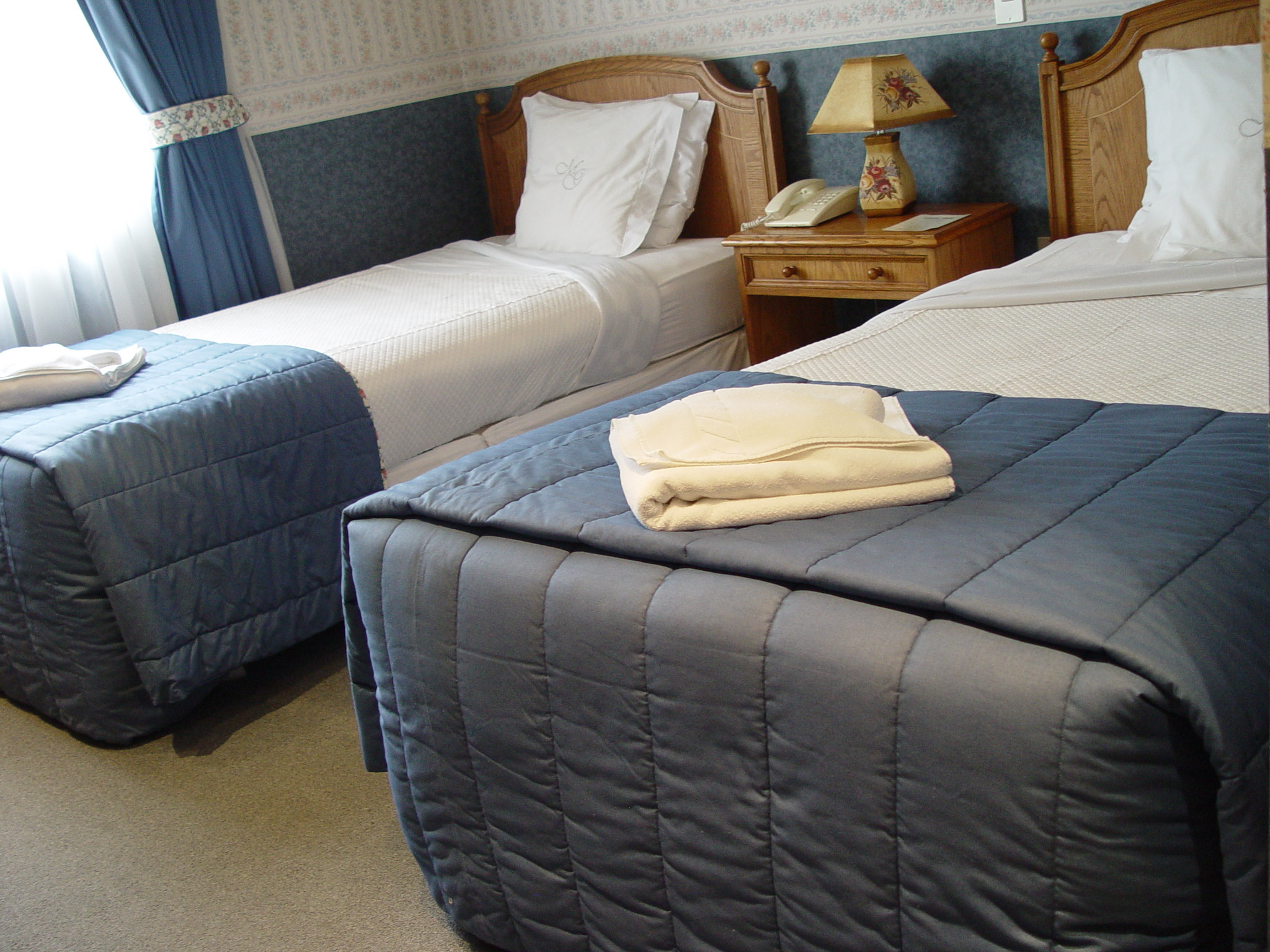 View of the Hotel Martin Gusinde reception desk, featuring polished wood and helpful tourist information.