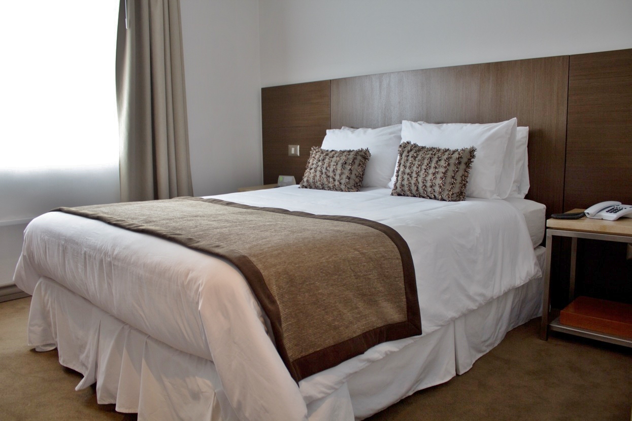 The inviting hotel bar at Martin Gusinde, featuring a wide selection of local spirits and wines.