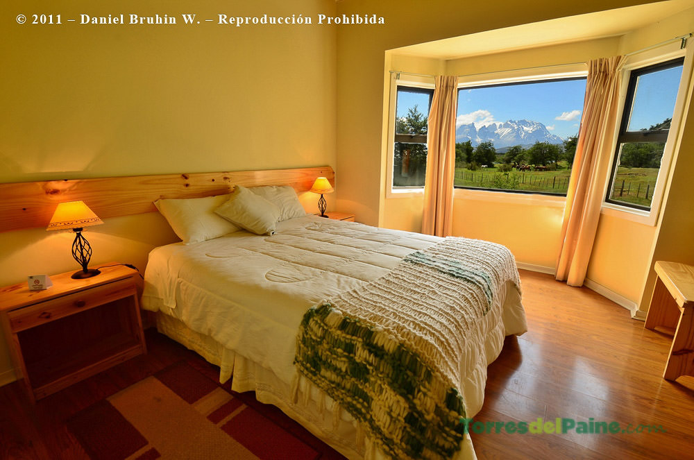 Outdoor terrace at Hotel Paine, perfect for watching the sunset over the Serrano River.