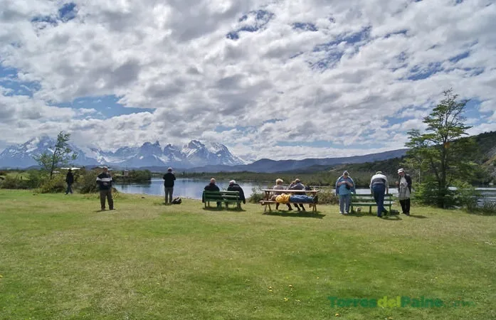 A peaceful garden path at Hotel Paine leading toward the river and mountain viewpoints.