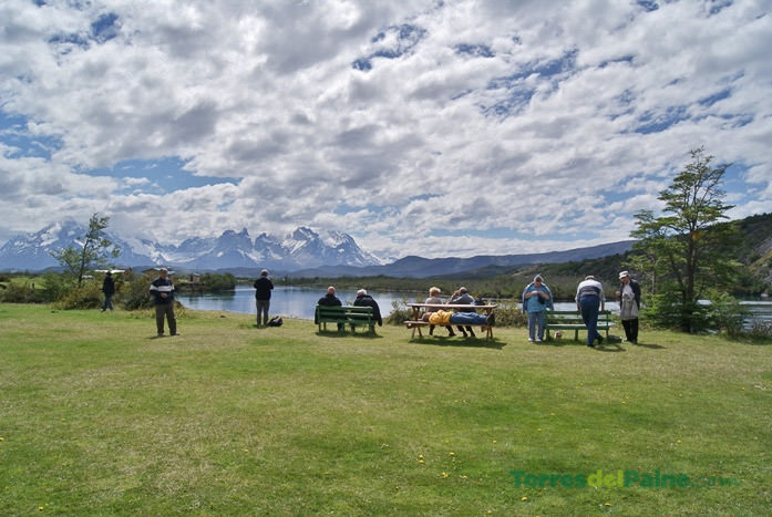A peaceful garden path at Hotel Paine leading toward the river and mountain viewpoints.