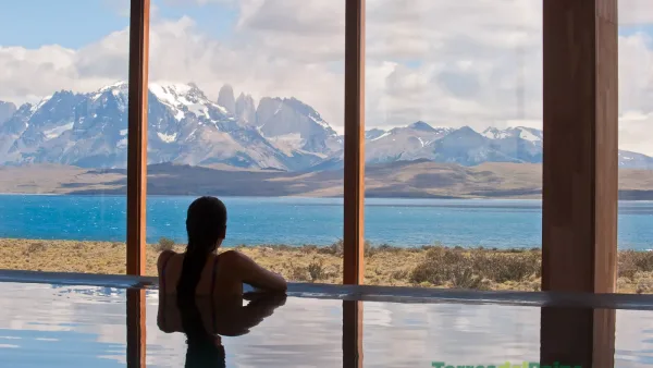 Interior of a guest room at Tierra Patagonia where the minimalist design frames a vast view of the national park.