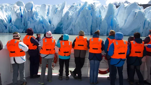 A guide on the Grey III boat explaining the geology and history of the Southern Patagonian Ice Field.