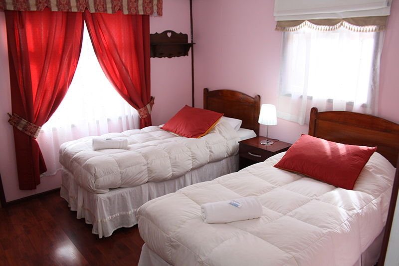 The common breakfast area at Hostal Alcazar, featuring local decor and a warm atmosphere.