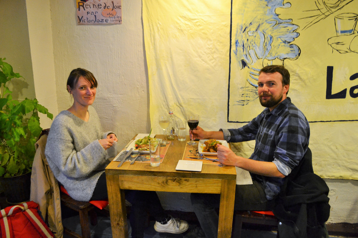 The kitchen staff at La Cuisine preparing meals in a modern open kitchen.