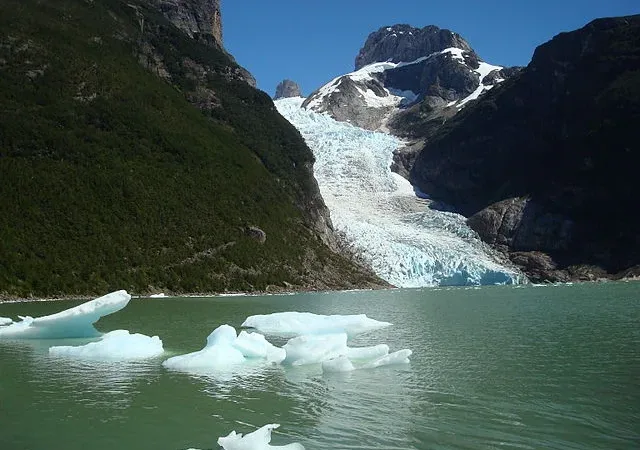 The face of the Serrano Glacier showing deep blue crevasses and ice textures.