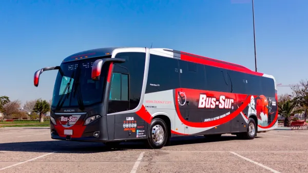 A Bus Sur coach waiting at the Punta Arenas airport terminal for passengers headed to Puerto Natales.