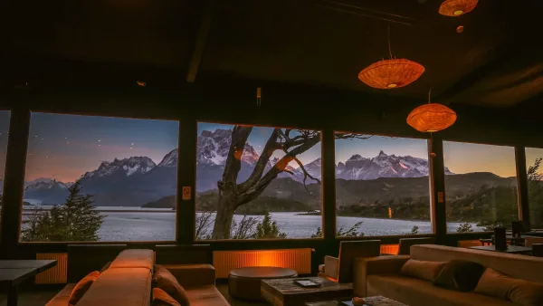 The lakeside entrance of Hotel Lago Grey surrounded by native Patagonian forest.