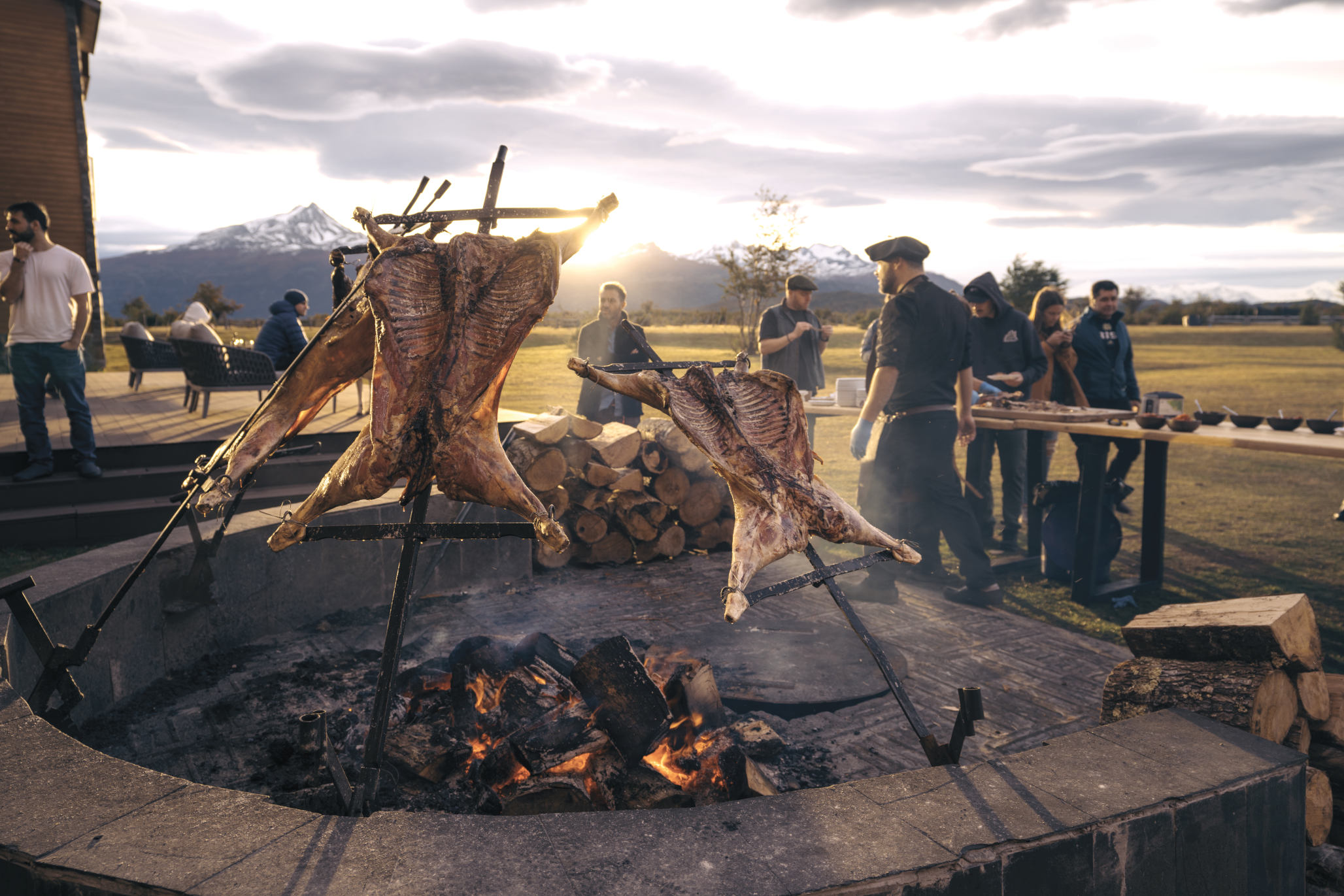 A luxury suite living area with a sofa, desk, and panoramic views of the Serrano River.