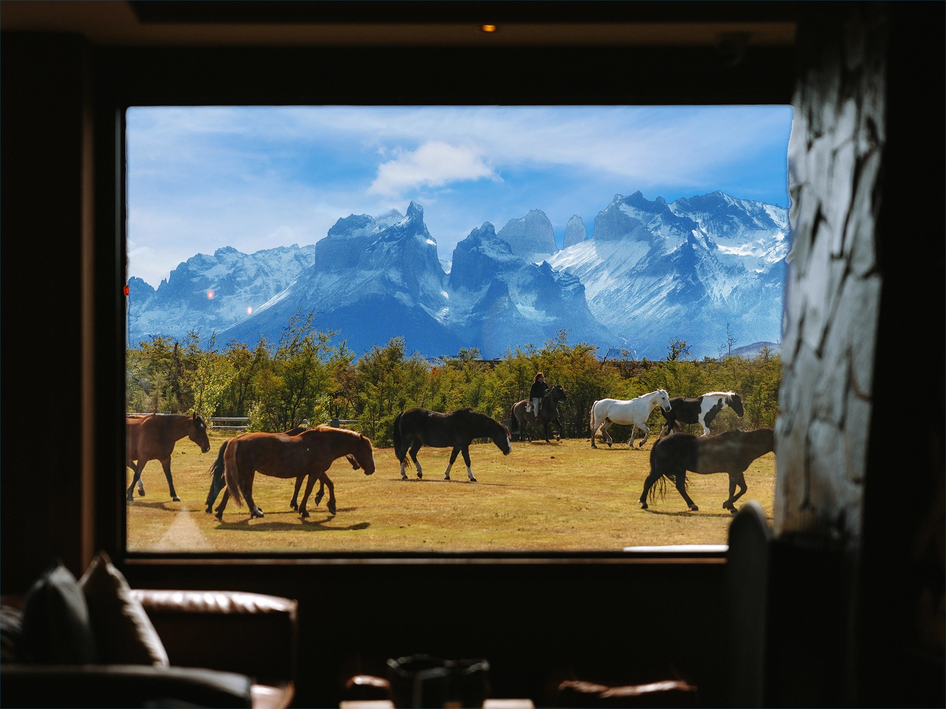 The sun setting over the Paine Massif as seen from the Hotel Río Serrano grounds.