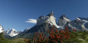 A breathtaking wide panoramic shot of the Cuernos del Paine reflected in Lake Pehoé.