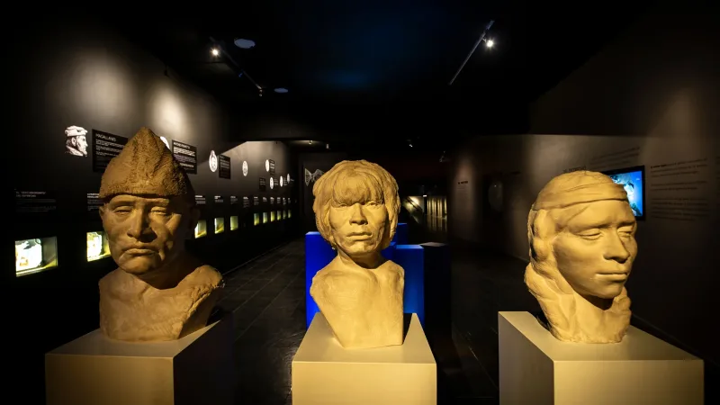 Bronze busts of historical figures displayed in the modern Visitor Center museum.