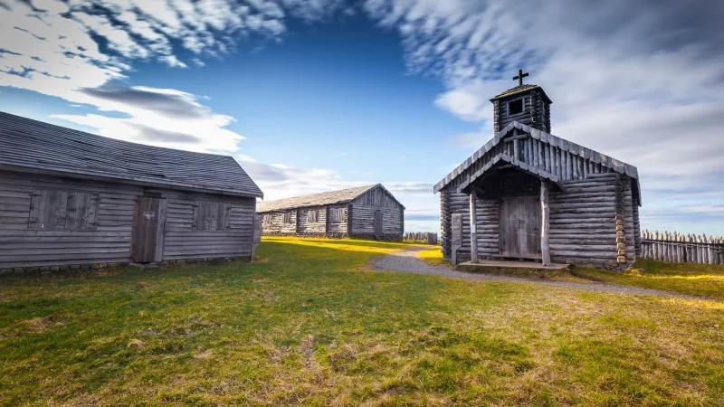 The historic wooden fortifications and chapel inside the Fuerte Bulnes complex.