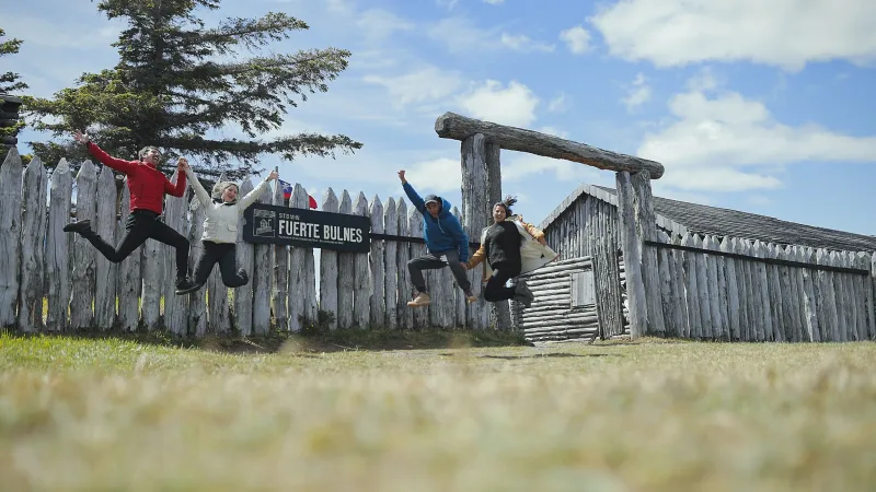 A wooden boardwalk leading visitors through the palisade walls of the fort.